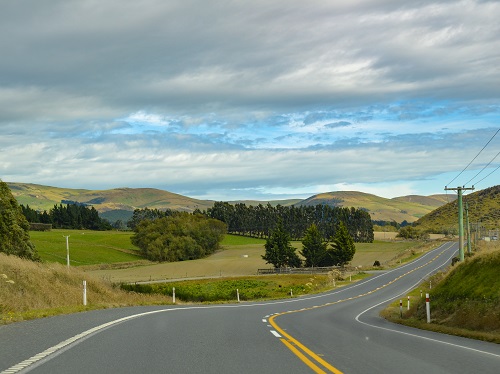 View of a winding road and hills in New Zealand